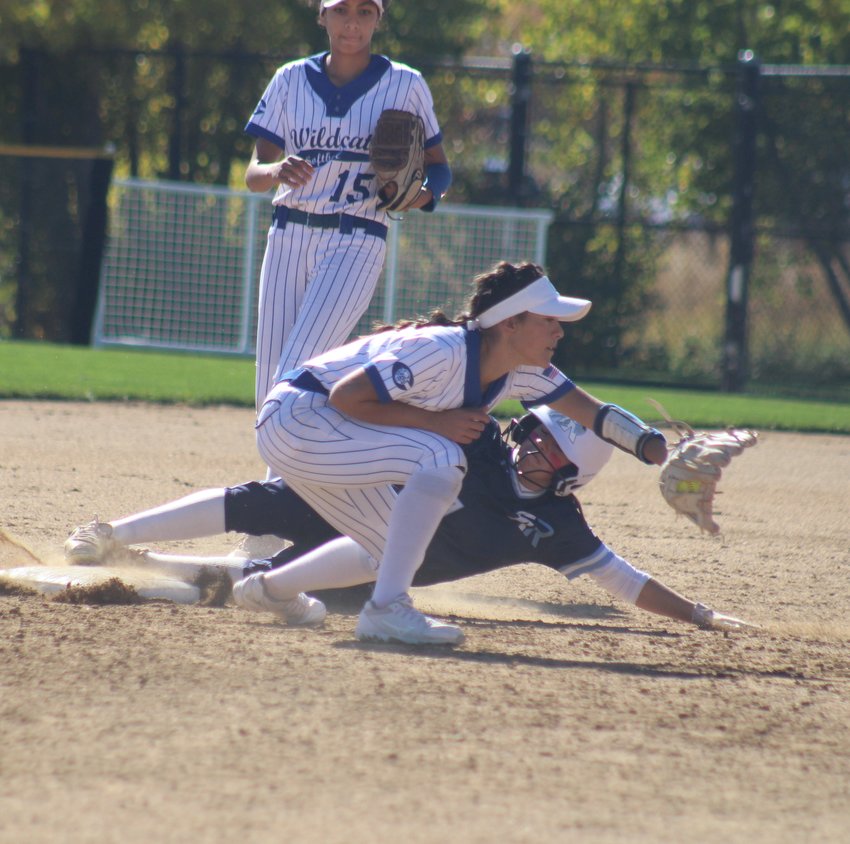 Riverdale Ridge's Anjolina Cordova slides into second base safely as Pueblo Central's Mikayla Cruz awaits the late throw.